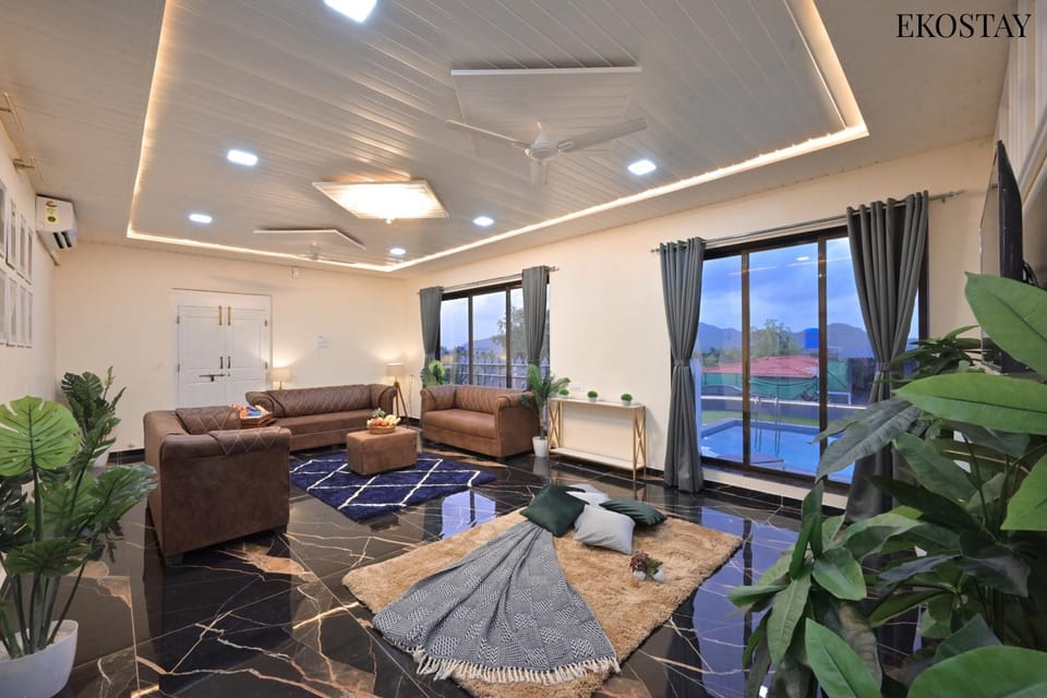 Living room, Seating area, Swimming pool, sunbed, air conditioner