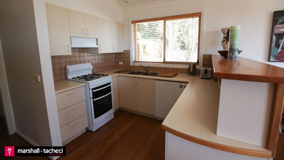 Kitchen or kitchenette, dishwasher, oven, stove