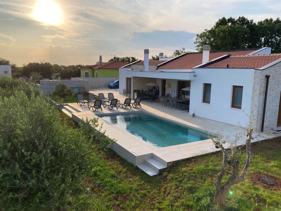 Property building, Patio, Natural landscape, Swimming pool
