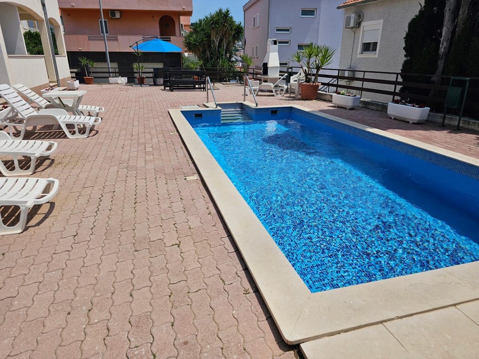 Property building, Pool view, Swimming pool, sunbed