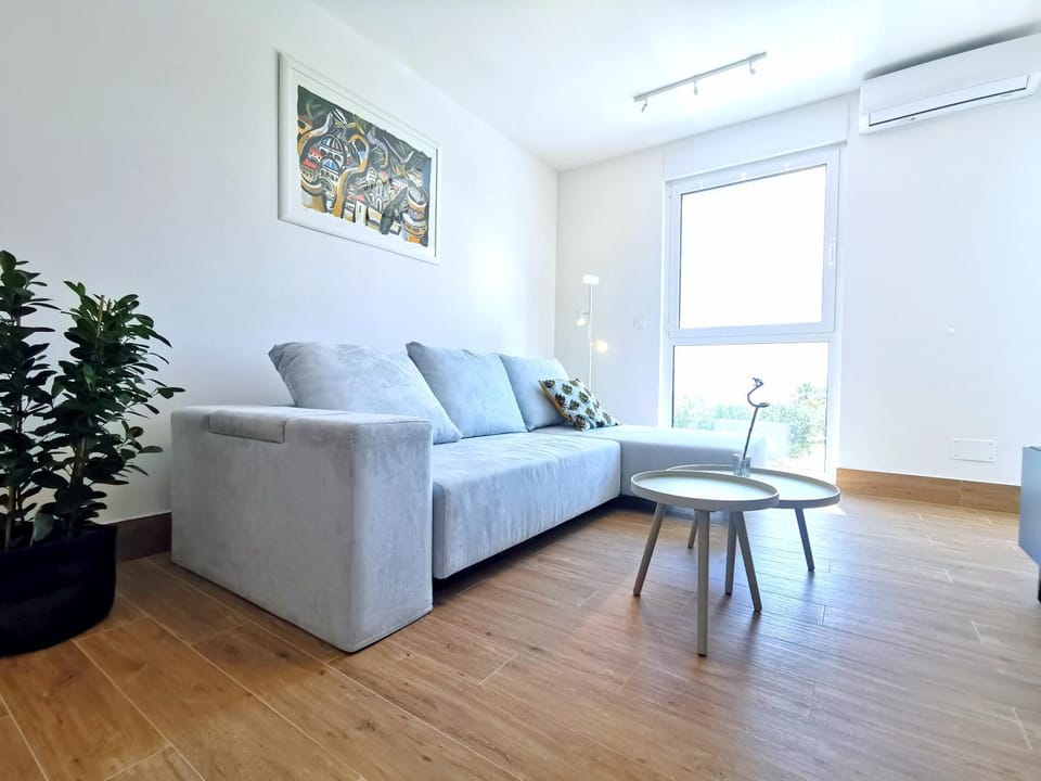Day, Living room, Seating area, air conditioner