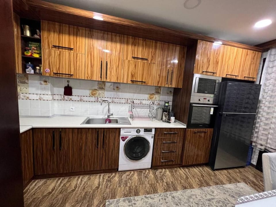 Kitchen or kitchenette, oven, stove, washing machine, dryer