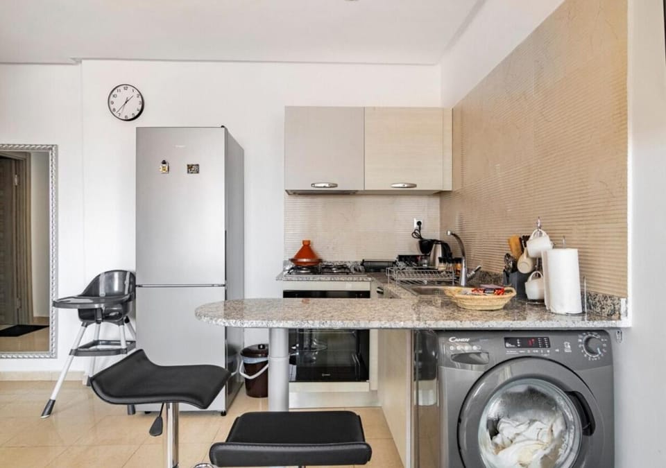 Kitchen or kitchenette, washing machine