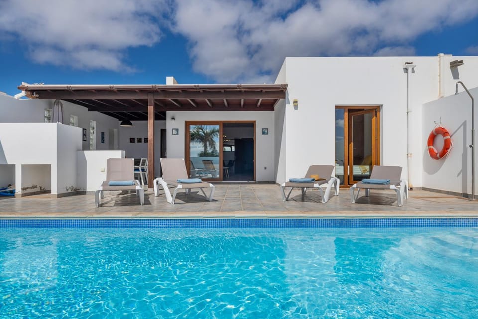 Property building, Living room, Swimming pool