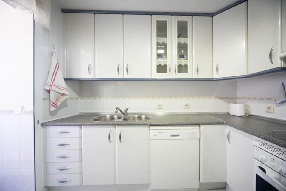 Kitchen or kitchenette, dishwasher, stove, washing machine