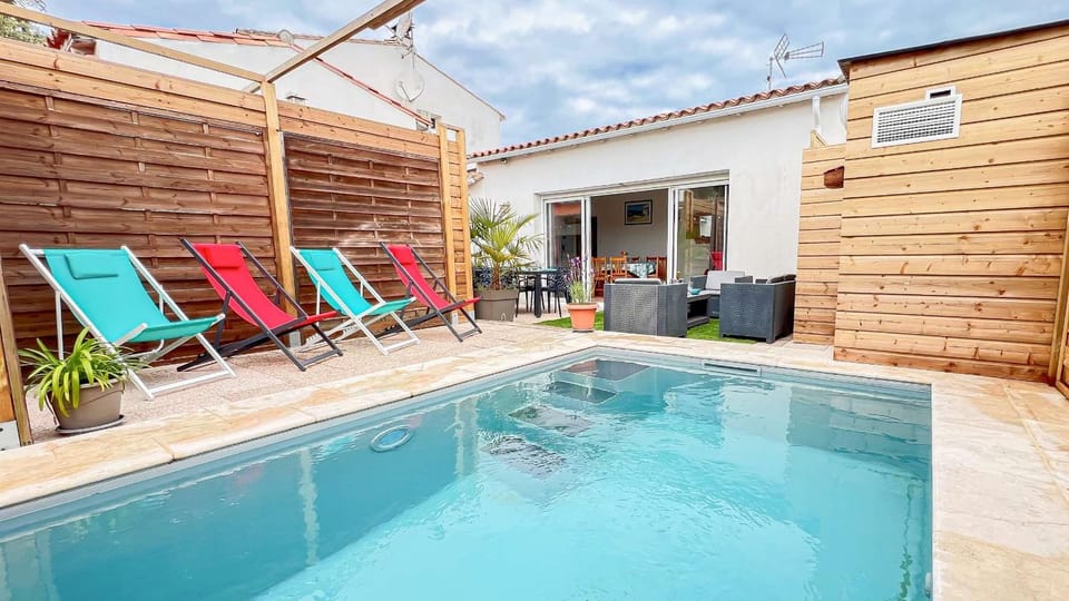 Property building, Patio, Pool view, Swimming pool, sunbed