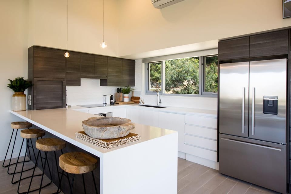 Kitchen or kitchenette, dishwasher, oven, stove