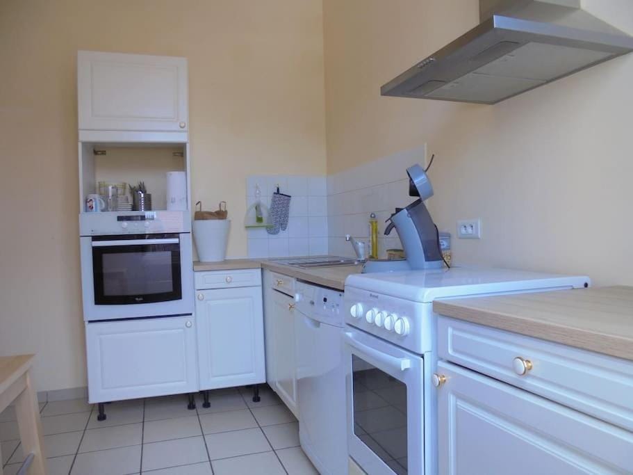 Kitchen or kitchenette, dishwasher, oven, stove