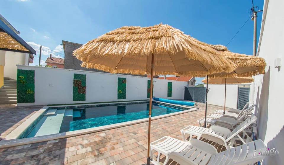 Property building, Pool view, Swimming pool, sunbed