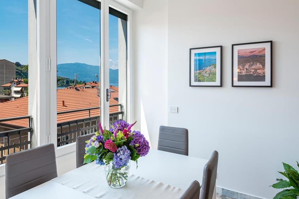 Natural landscape, View (from property/room), Living room, Seating area, Dining area, Lake view, Mountain view
