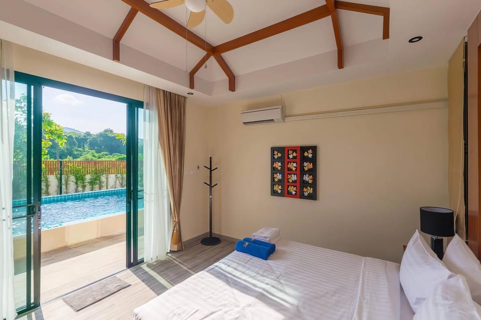 Bed, Bedroom, Pool view, Swimming pool, sunbed, towels, air conditioner