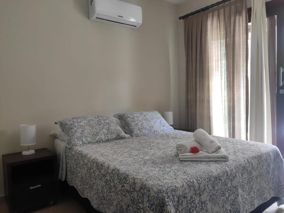 Bed, Photo of the whole room, Bedroom, towels, air conditioner