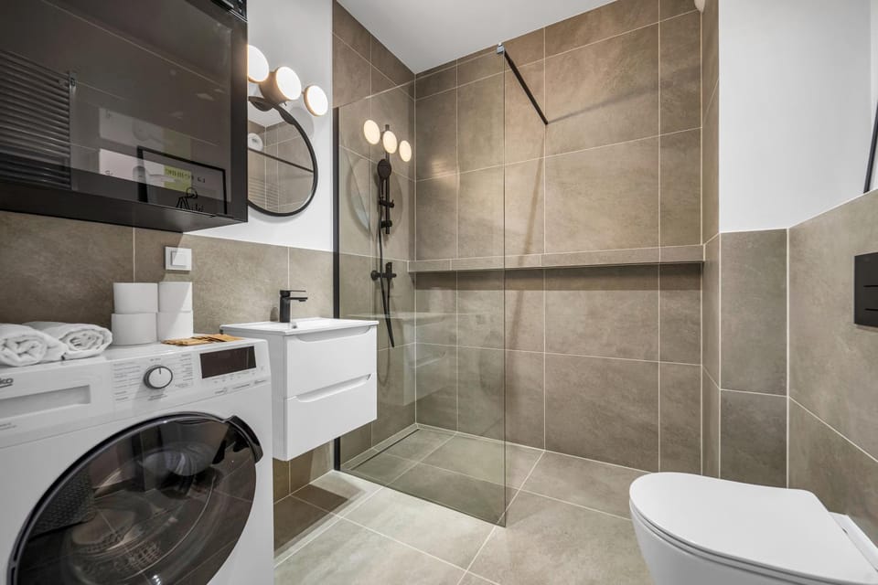Shower, Toilet, Bathroom, towels, washing machine, dryer
