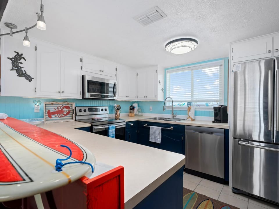 Kitchen or kitchenette, dishwasher, microwave, oven, stove, kitchen