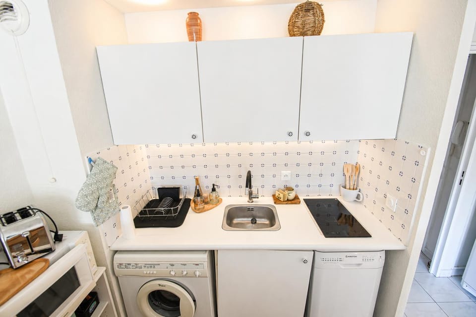 Kitchen or kitchenette, dishwasher, stove, toaster, washing machine