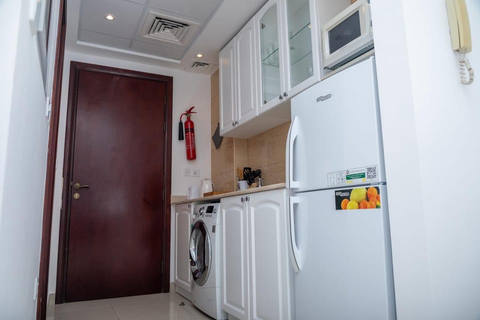 Kitchen or kitchenette, stove, washing machine, kitchen