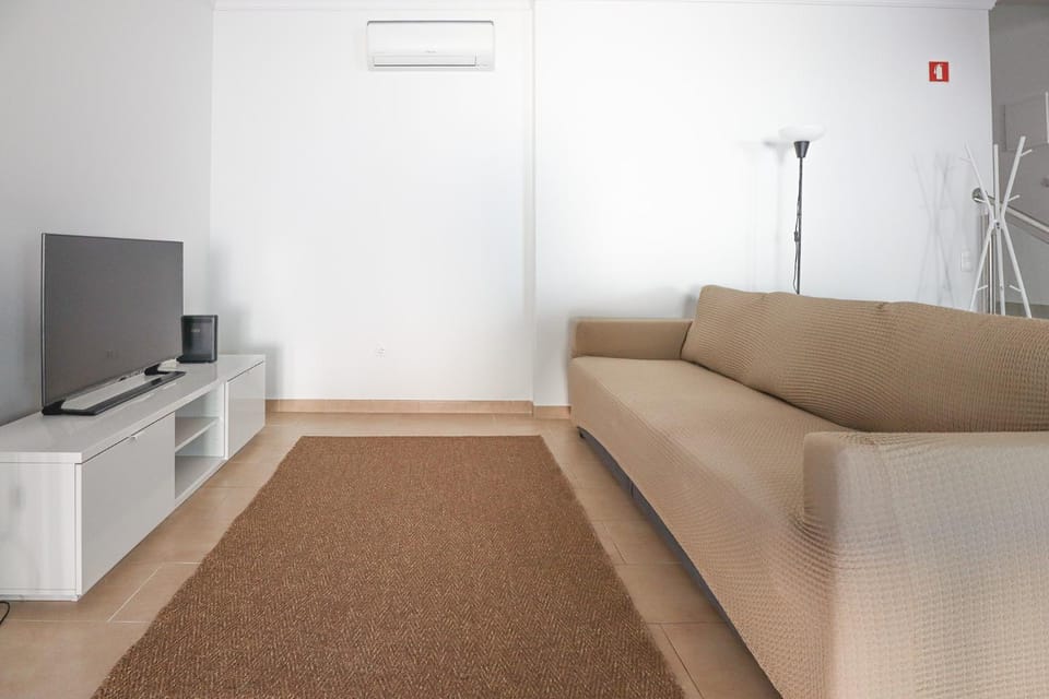 Communal lounge/ TV room, Living room, Seating area, locker, air conditioner