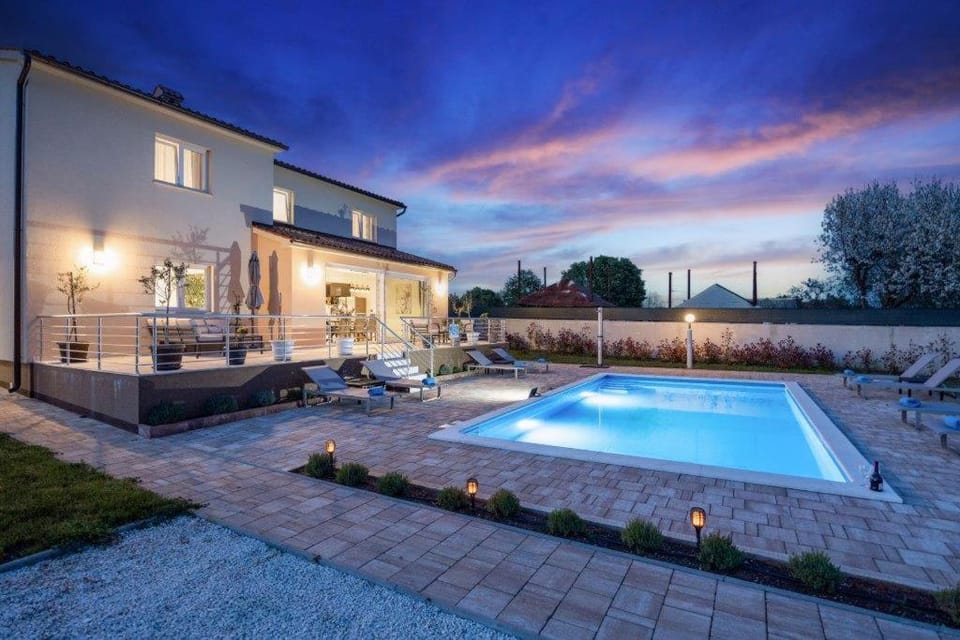 Property building, Patio, Night, Natural landscape, Pool view, Swimming pool, sunbed