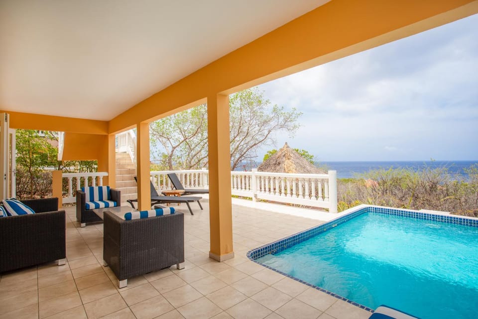 View (from property/room), Balcony/Terrace, Pool view, Sea view, Swimming pool, sunbed