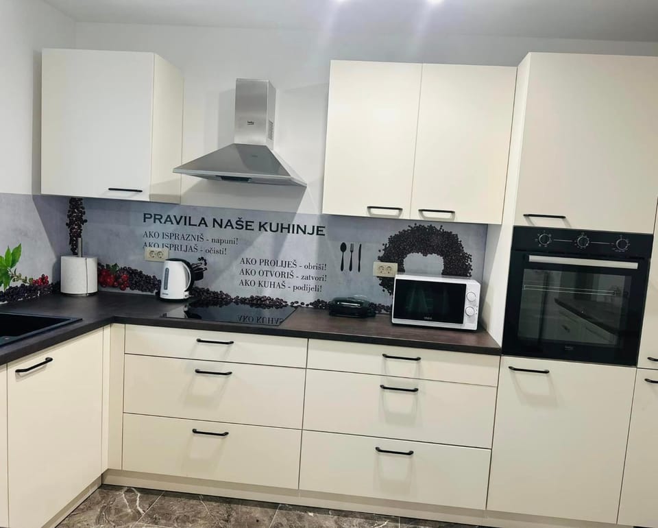 Kitchen or kitchenette, dishwasher, oven, stove, toaster