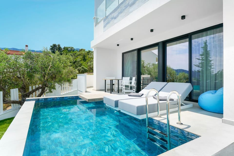Property building, Day, Seating area, Pool view, sunbed