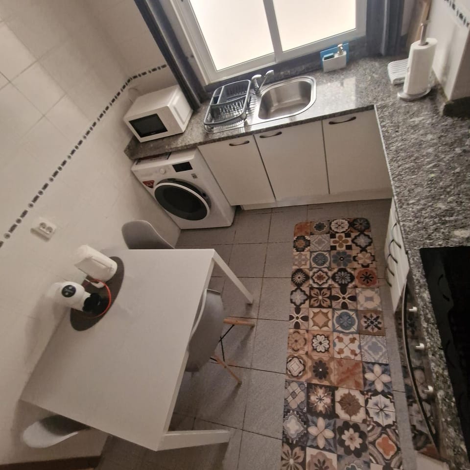 Kitchen or kitchenette, Dining area, oven, stove, washing machine, dryer