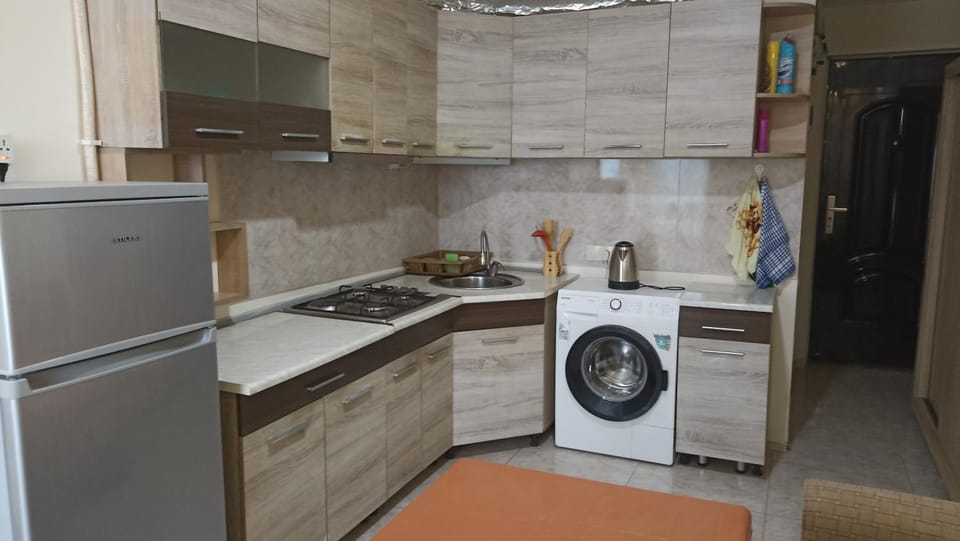 Kitchen or kitchenette, stove, washing machine