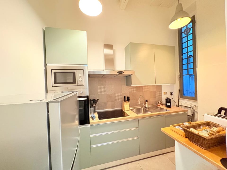 Kitchen or kitchenette, dishwasher, oven, stove, toaster