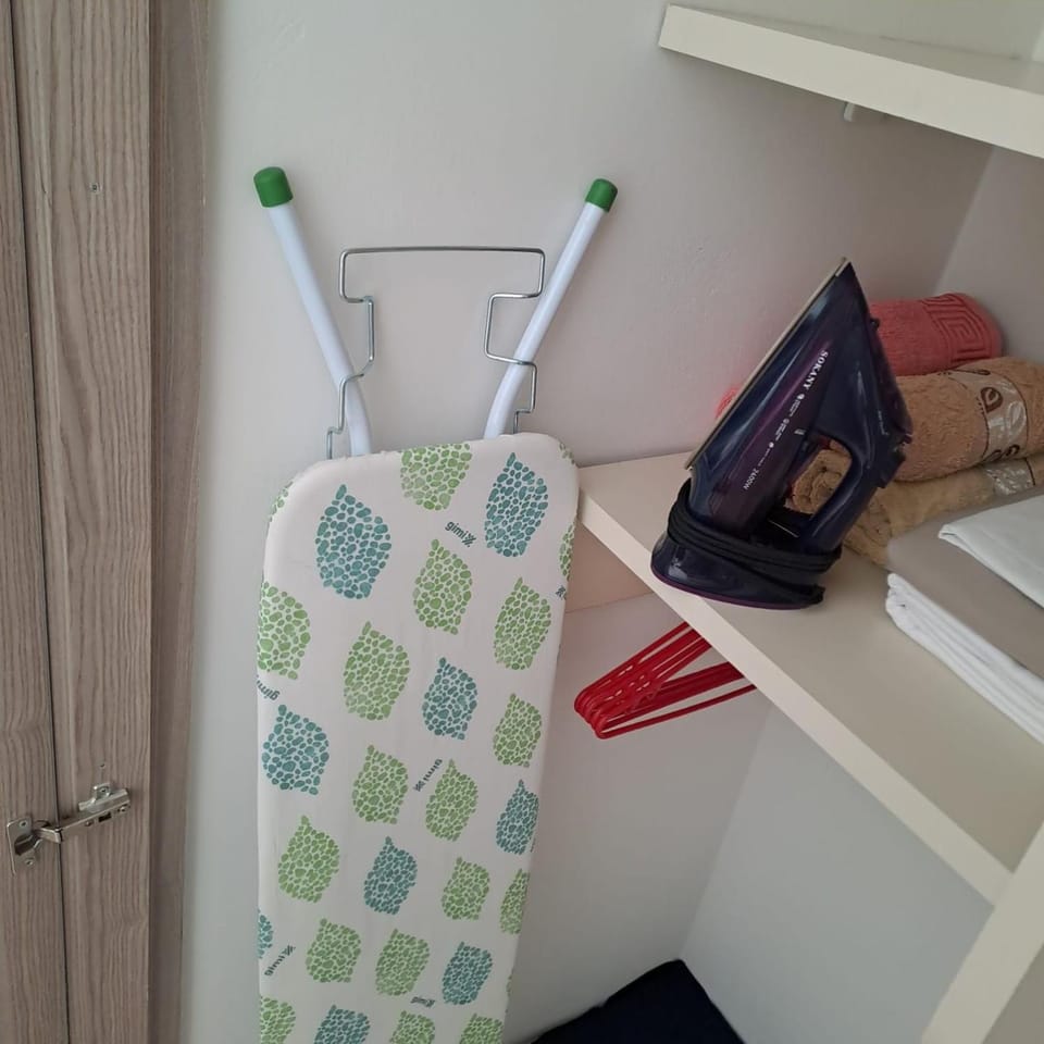 flat iron, towels, wardrobe
