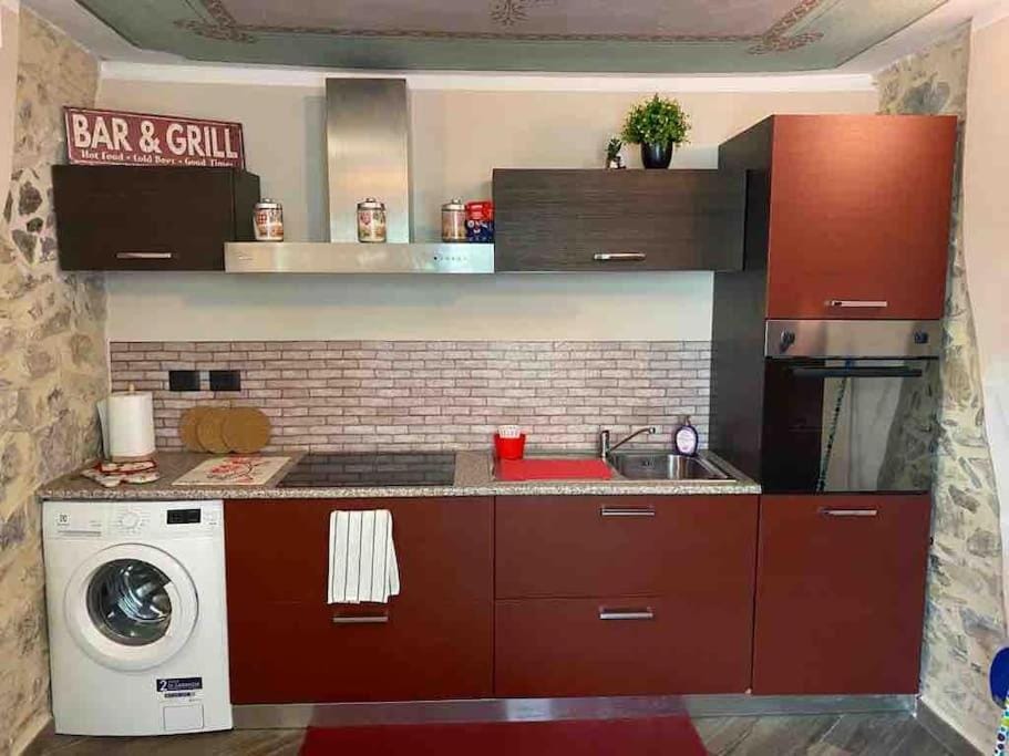 Kitchen or kitchenette, washing machine