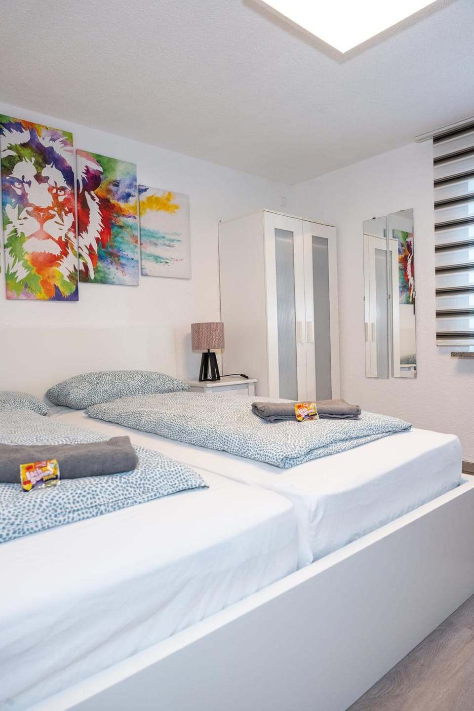 Bed, Photo of the whole room, Decorative detail, towels, wardrobe
