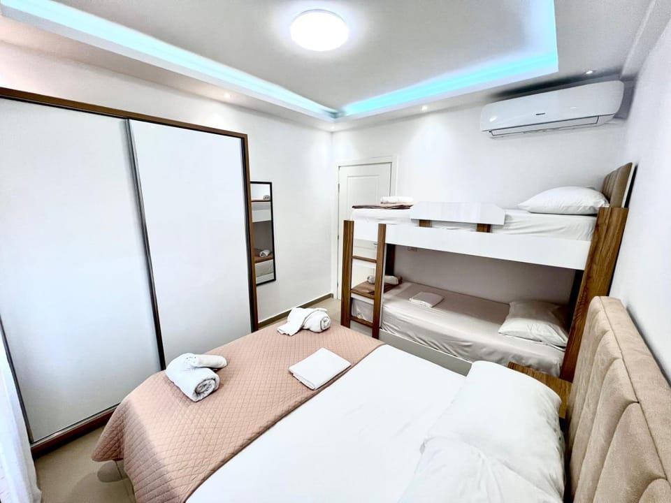 Bed, Photo of the whole room, Bedroom, bunk bed, towels, wardrobe, air conditioner
