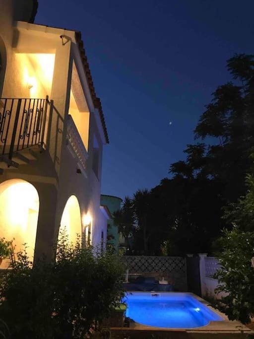 Property building, Patio, Night, Pool view, Swimming pool