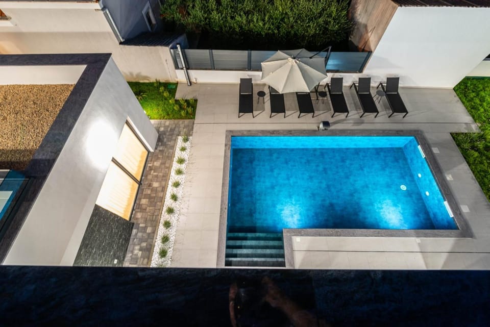 Patio, Night, Pool view, Swimming pool, sunbed