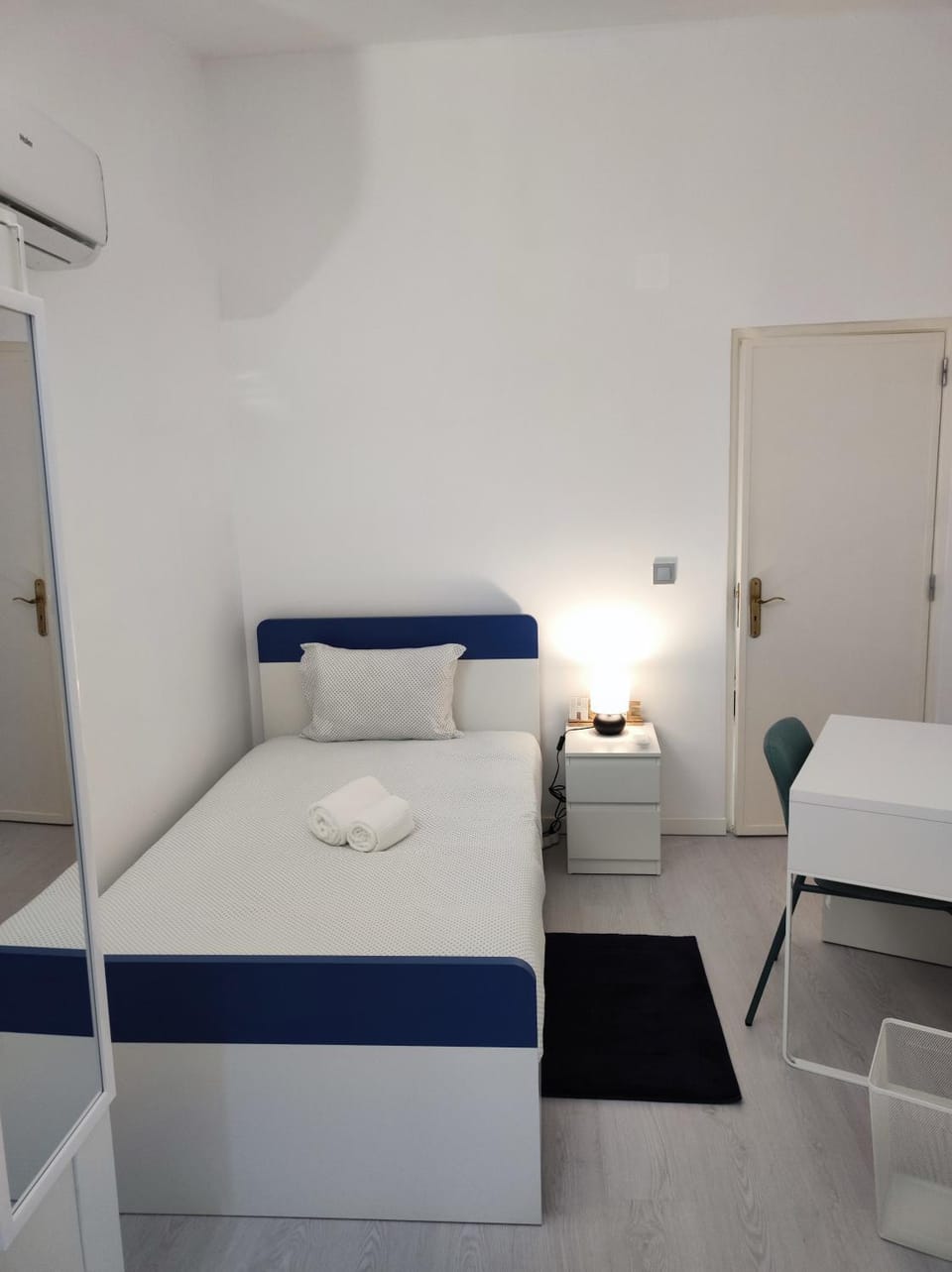 Bed, Photo of the whole room, Seating area, Bedroom, hair dresser, towels, wardrobe, air conditioner