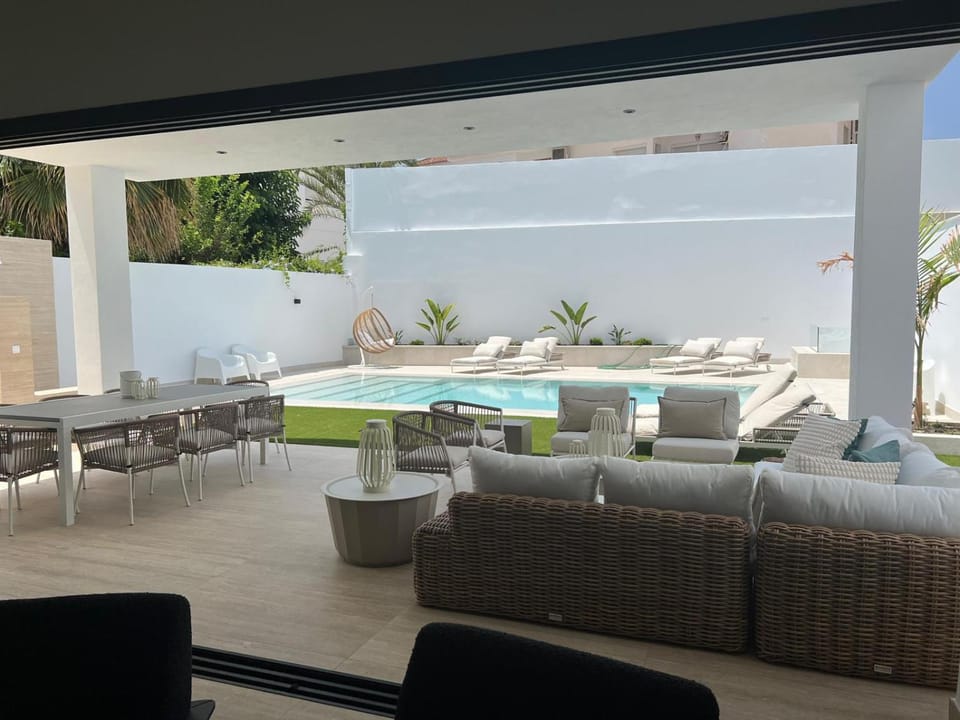 Patio, Living room, Seating area, Dining area, Pool view, Swimming pool, sunbed