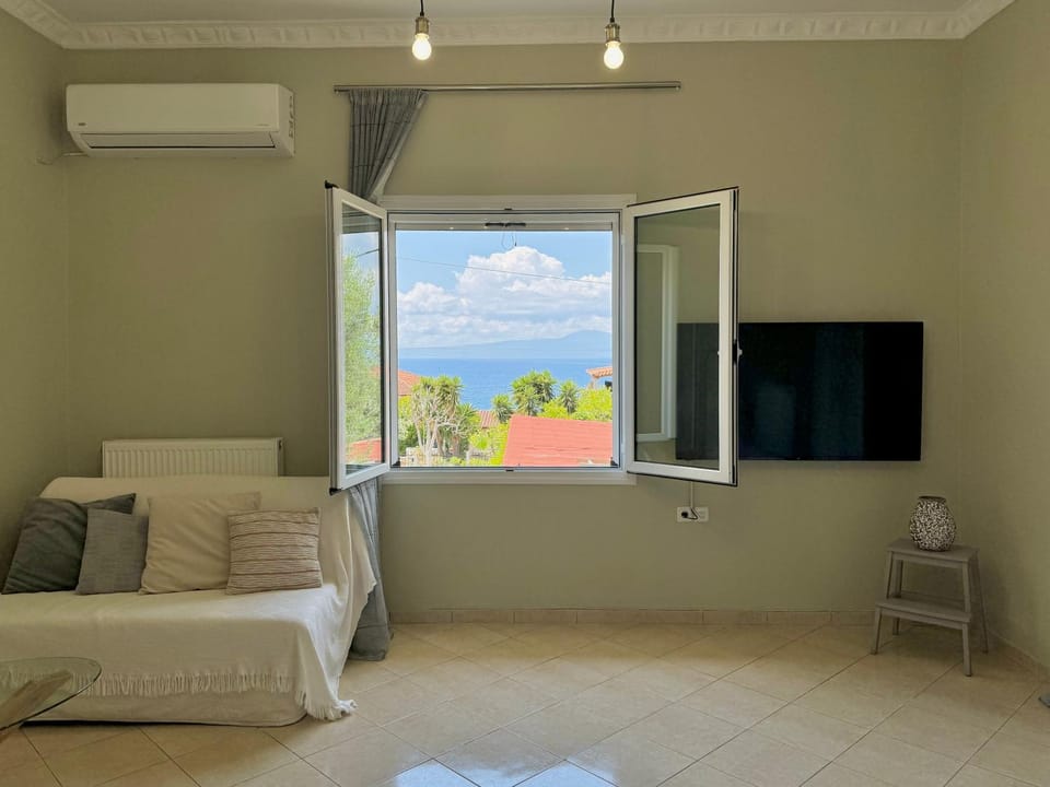 TV and multimedia, View (from property/room), Photo of the whole room, Seating area, Mountain view, Sea view, air conditioner