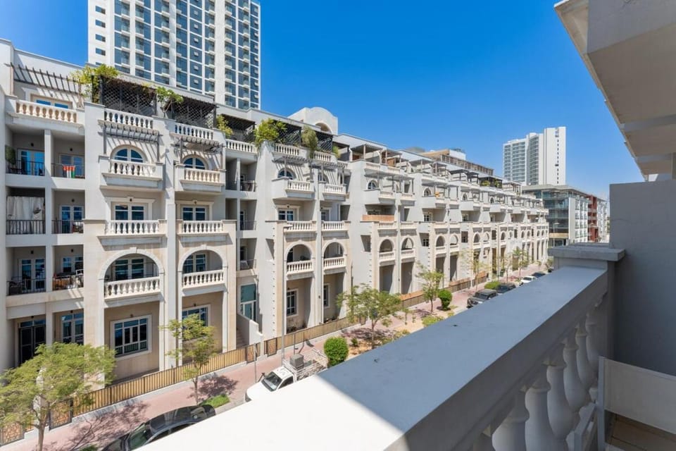 Contemporary 2BR w/ Maid's Room at JVC Apartment in Dubai