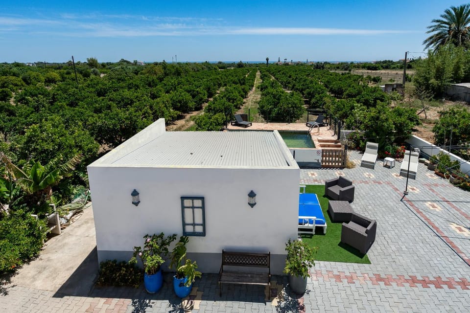 Property building, Spring, Day, Property logo or sign, Neighbourhood, Natural landscape, Swimming pool, Parking, furniture, sunbed