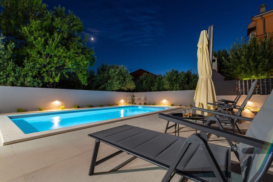 Patio, Night, Pool view, Swimming pool, sunbed