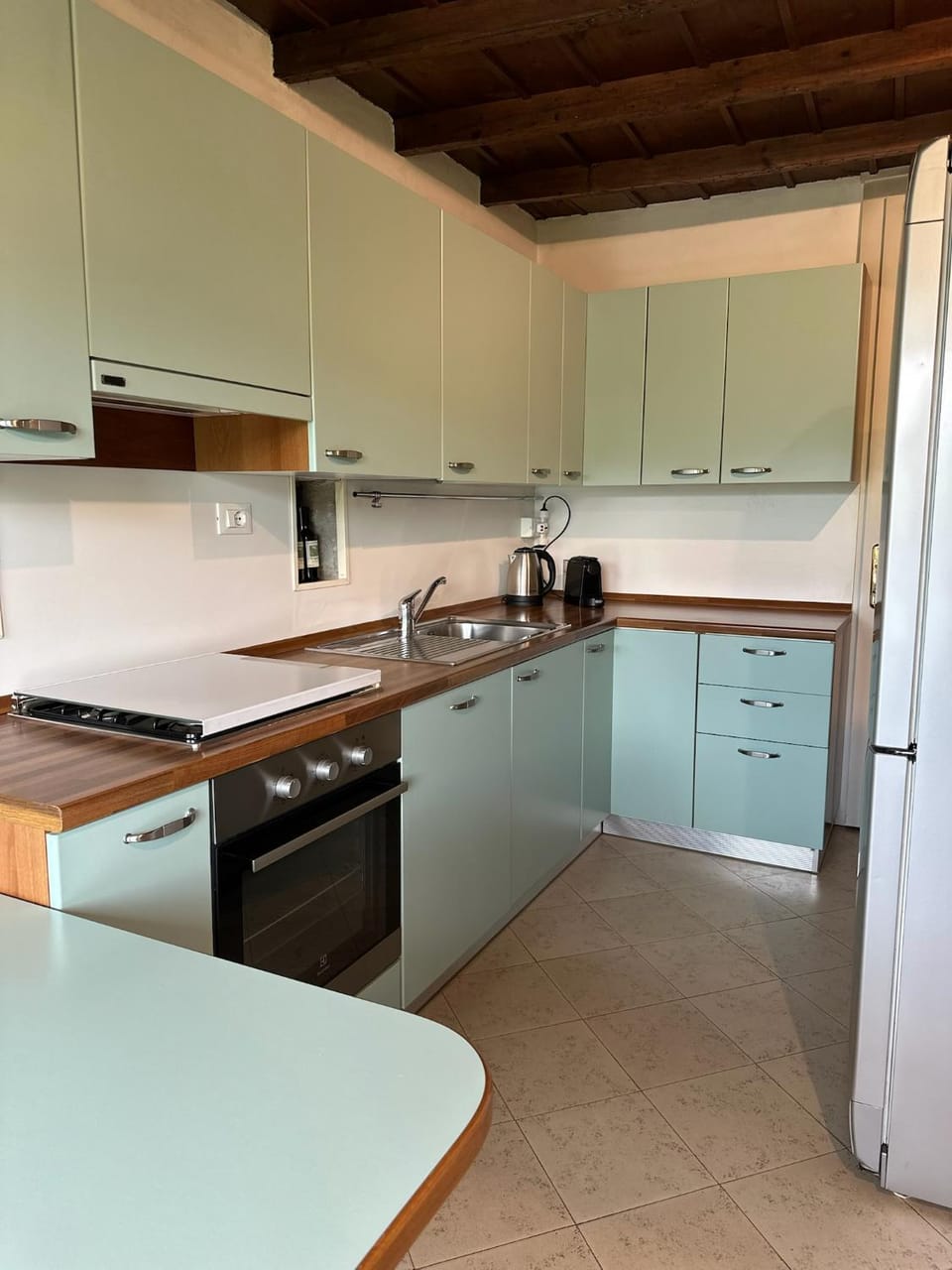 Kitchen or kitchenette, dishwasher, oven, stove