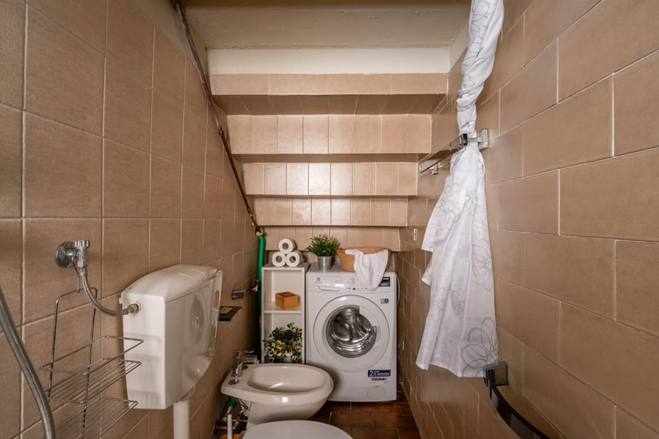 Shower, Toilet, Bathroom, bidet, towels, washing machine
