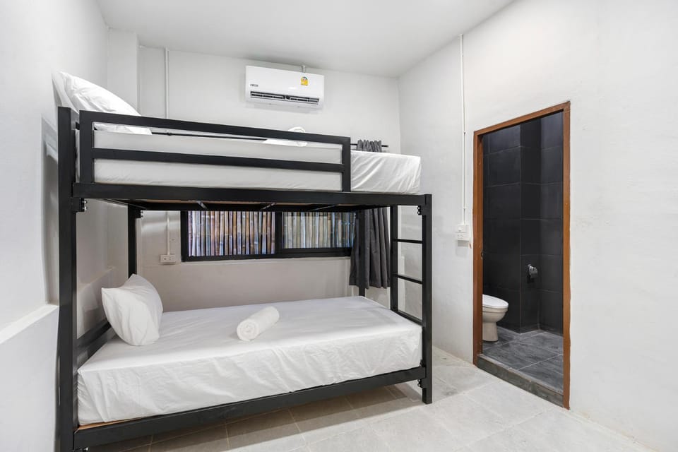 Bed, Photo of the whole room, Bedroom, bunk bed, towels, air conditioner