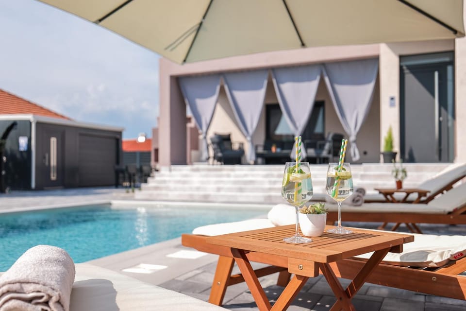 Property building, Day, Seating area, Pool view, Swimming pool, sunbed