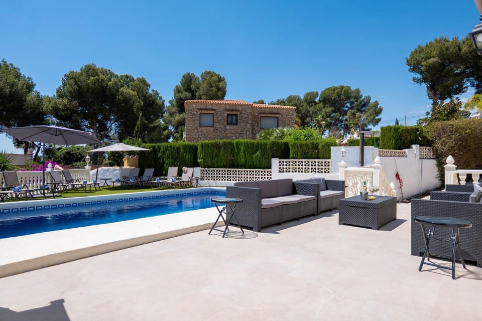 Property building, Patio, Day, Living room, Seating area, Pool view, Swimming pool, sunbed