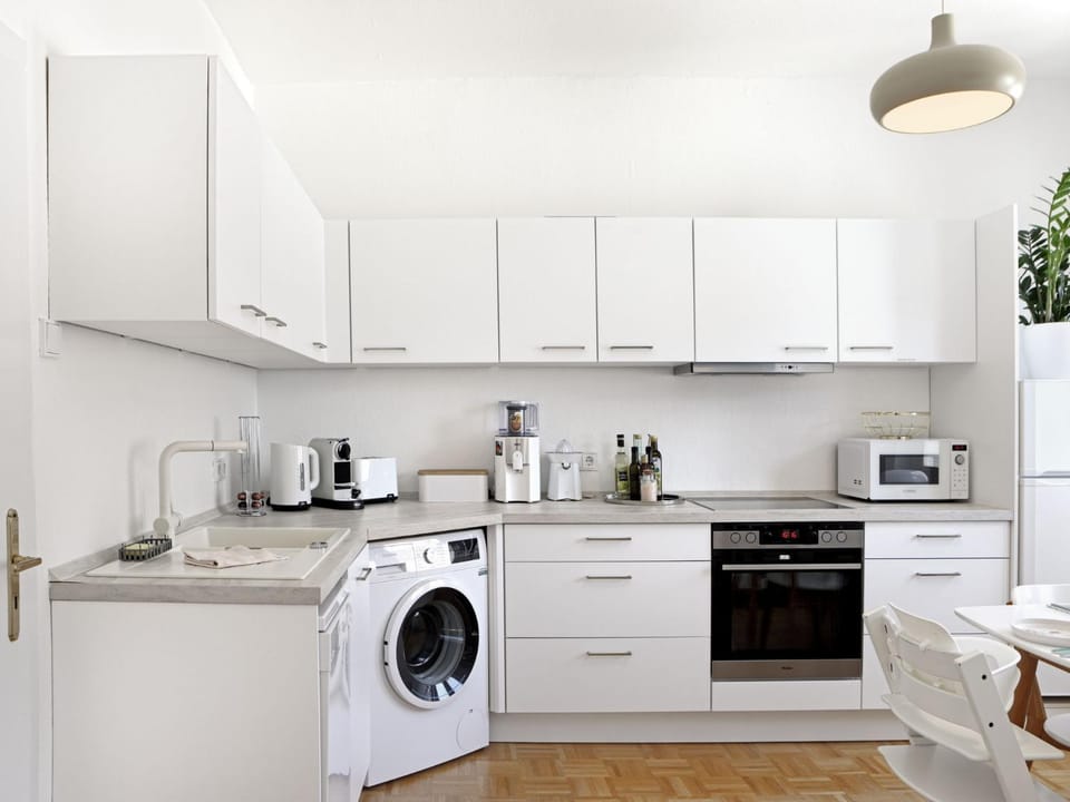 Kitchen or kitchenette, oven, stove, washing machine