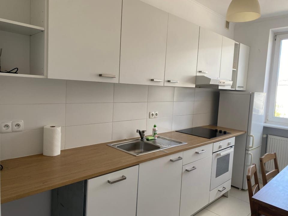 Kitchen or kitchenette, dishwasher, oven, stove