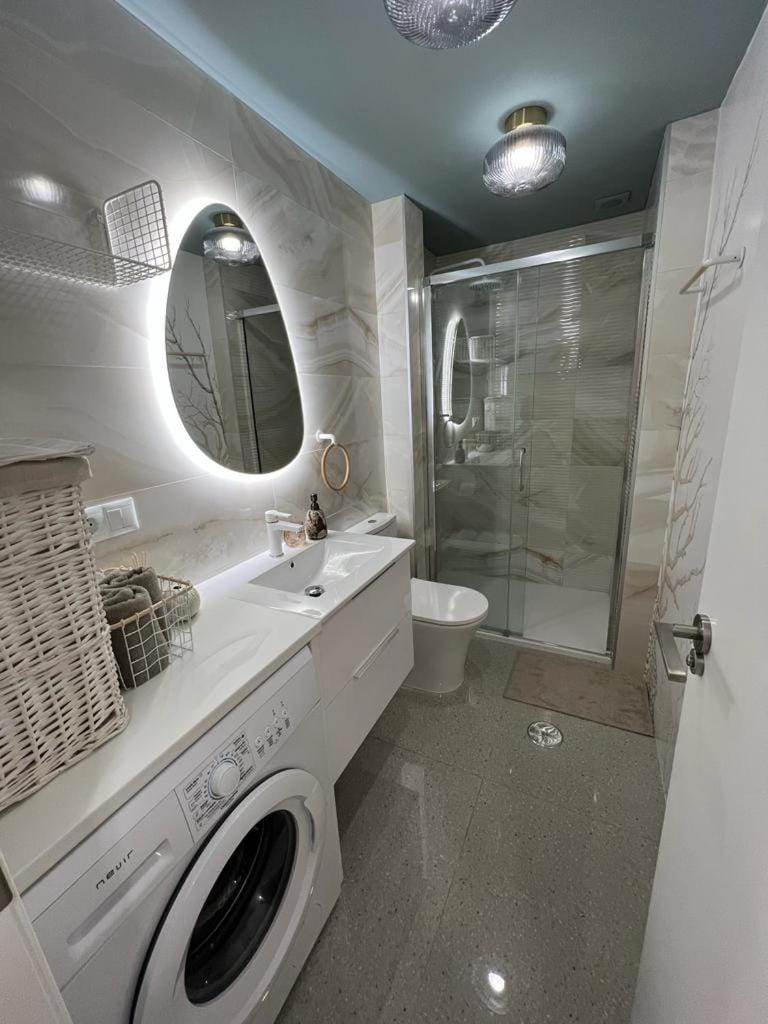 Shower, Toilet, Bathroom, towels, washing machine, dryer
