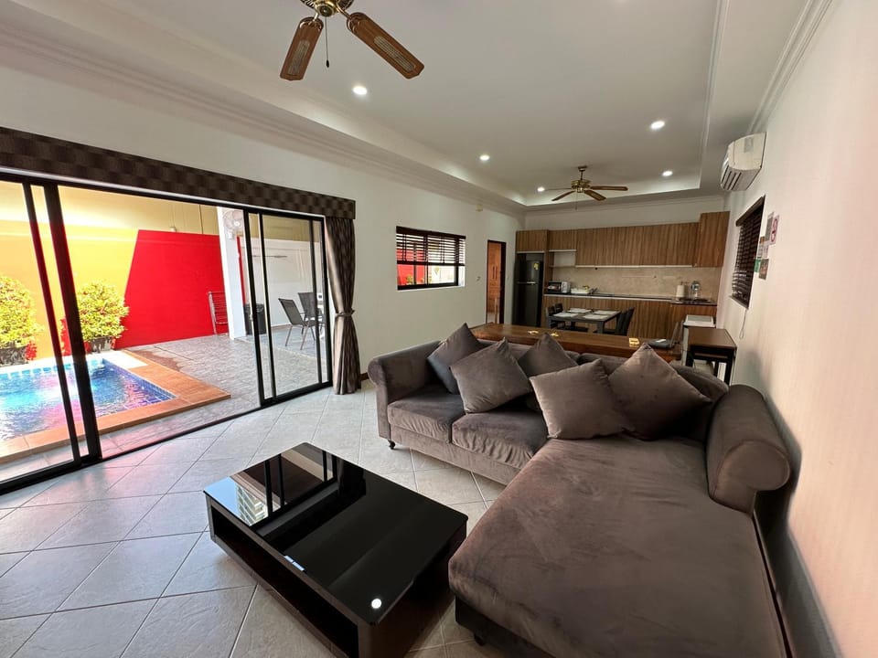 Living room, Seating area, Pool view