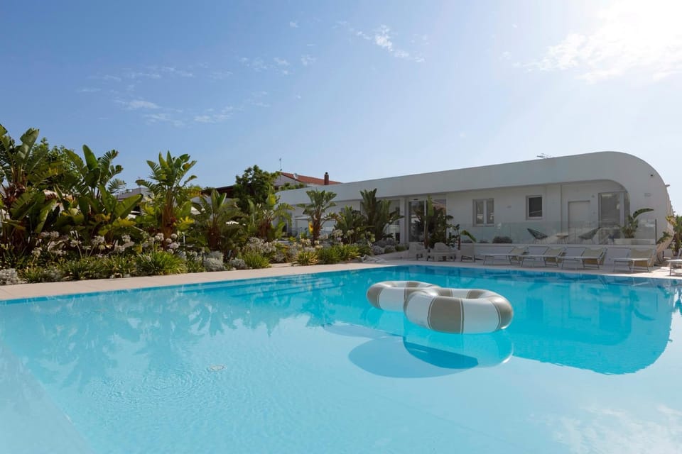 Property building, Natural landscape, Pool view, Swimming pool, sunbed